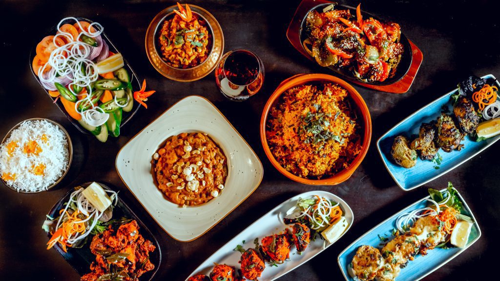 A spread of dishes from The Grand Palace, ready for pickup